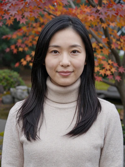 Yuki Tanaka, a 27-year-old Japanese woman from Tokyo smiling in an autumn garden - Japanese women dating profile
