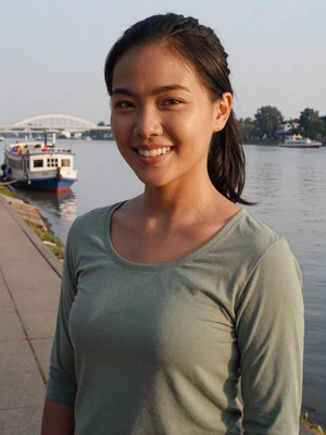 Su Su, a 29-year-old Burmese woman from Mawlamyine on a riverside promenade - Burmese women dating profile