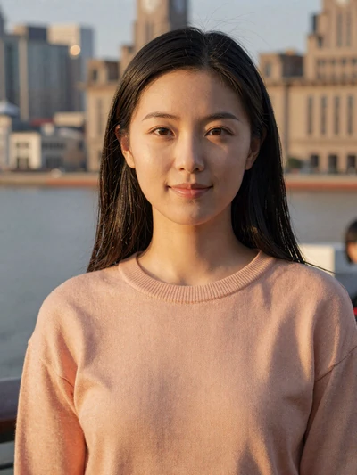 Mei Lin, a 28-year-old Chinese woman from Shanghai smiling at the Bund waterfront - Chinese women dating profile