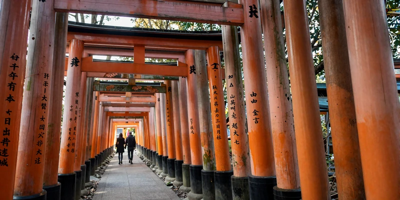 Fushimi Inari shrine in Kyoto with orange torii gates - a romantic destination for meeting Japanese women