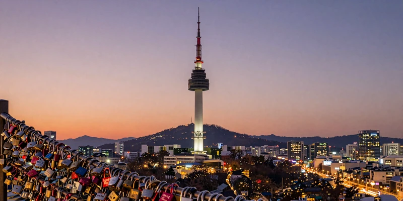 N Seoul Tower at dusk with love locks - a romantic destination for meeting Korean women