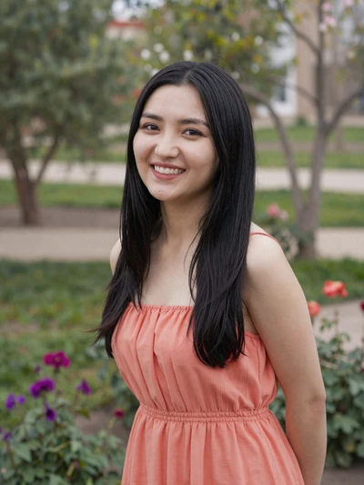Cholpon Bektenova, a 26-year-old Kyrgyz woman from Jalal-Abad in a flower garden - Kyrgyz women dating profile