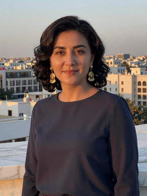 Merjen Chariyeva, a 30-year-old Turkmen woman from Ashgabat on a rooftop terrace at sunset - Turkmen women dating profile
