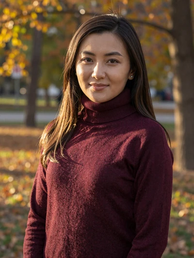 Ainur Serikova, a 27-year-old Kazakh woman from Almaty smiling in an autumn park - Kazakh women dating profile
