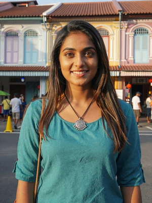 Priya Nair, a 25-year-old Indian-Singaporean woman from Little India with a bright smile - Singaporean women dating profile
