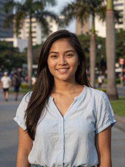 Camille Reyes, 27-year-old Filipino woman smiling in Manila park - long-distance dating profile