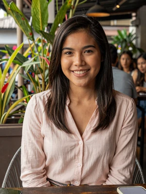 Ploy Suksawat, 25-year-old Thai woman at a Bangkok outdoor cafe - Thai women dating profile