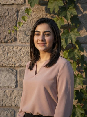 Farzona Karimova, a 25-year-old Tajik woman from Khujand near a historic wall - Tajik women dating profile