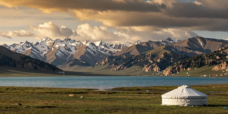 Issyk-Kul Lake surrounded by Tien Shan mountains with traditional yurt - the homeland beauty of Kyrgyz women on FloridaDatingService