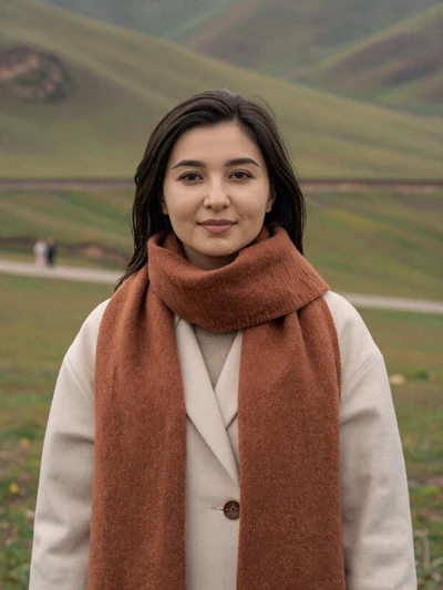 Aigul Mambetova, a 28-year-old Kyrgyz woman from Naryn on a mountain hillside - Kyrgyz women dating profile